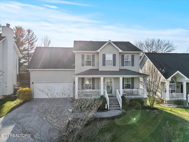 view of front of home featuring a porch, an attached garage, and driveway