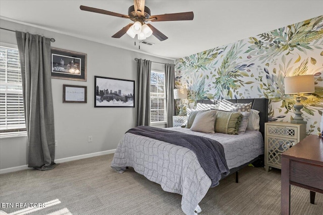 bedroom with a ceiling fan, baseboards, visible vents, wallpapered walls, and light colored carpet