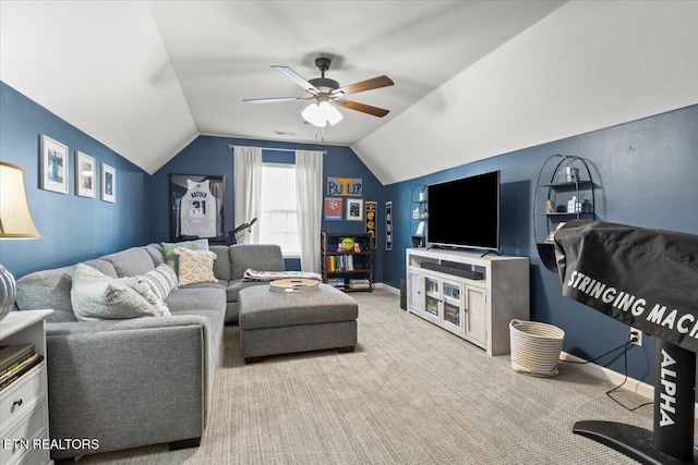 living room featuring baseboards, lofted ceiling, carpet, and ceiling fan