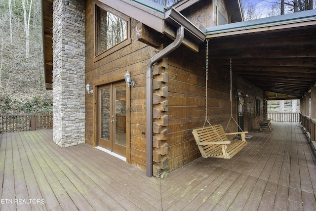 wooden deck featuring french doors