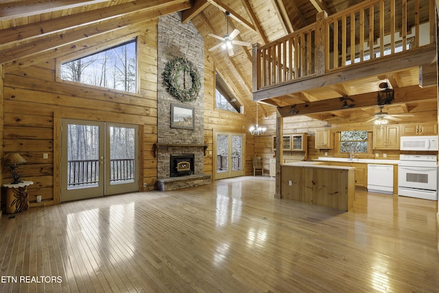 kitchen featuring white appliances, light countertops, open floor plan, and ceiling fan