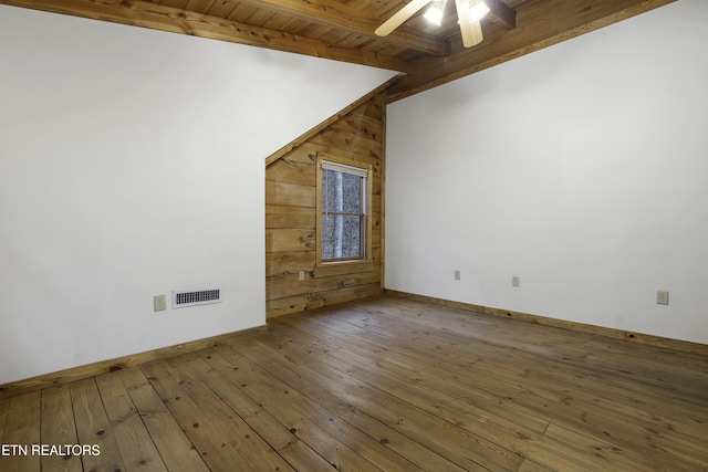 spare room with visible vents, baseboards, a ceiling fan, and hardwood / wood-style flooring