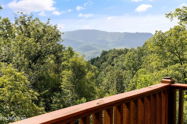 mountain view featuring a view of trees