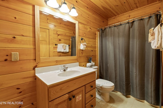 full bathroom with vanity, wood walls, tile patterned floors, toilet, and wooden ceiling