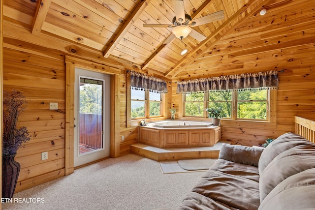 bathroom with a bath, wood walls, wooden ceiling, and vaulted ceiling with beams