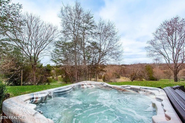 view of pool featuring a hot tub