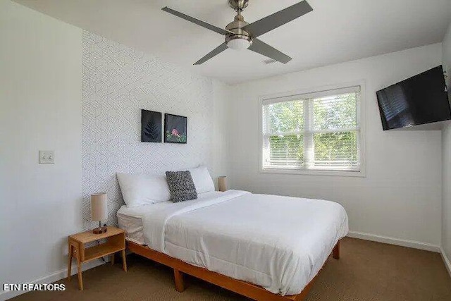 bedroom with baseboards and ceiling fan