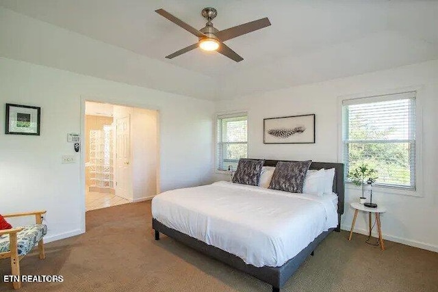 carpeted bedroom with baseboards and a ceiling fan