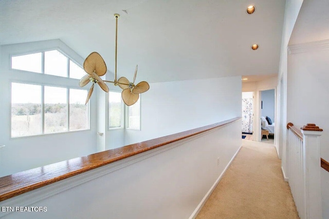 corridor featuring baseboards, vaulted ceiling, light carpet, an upstairs landing, and recessed lighting