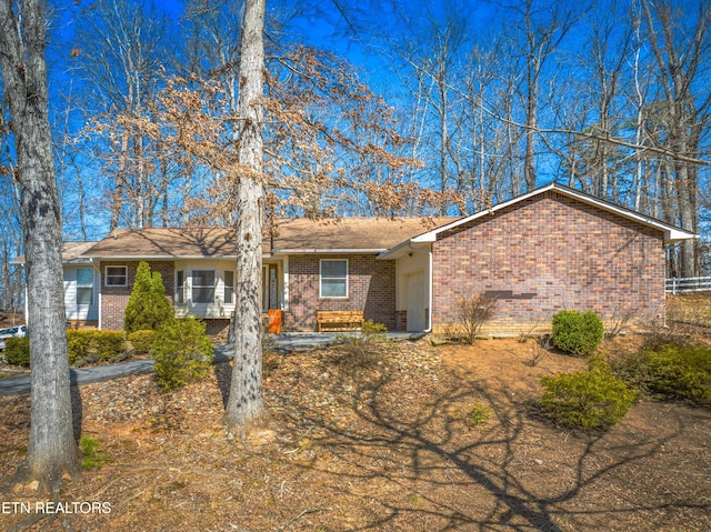 ranch-style house with brick siding and a garage