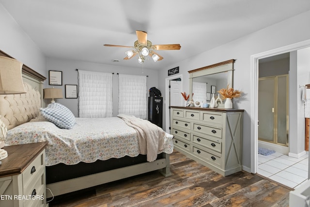 bedroom with baseboards, ceiling fan, and dark wood-style flooring