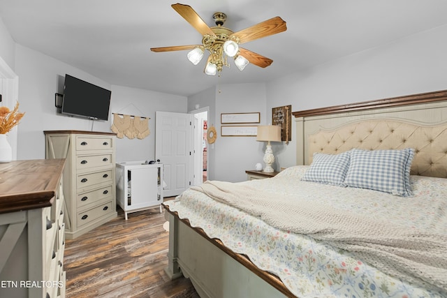 bedroom featuring dark wood finished floors and a ceiling fan