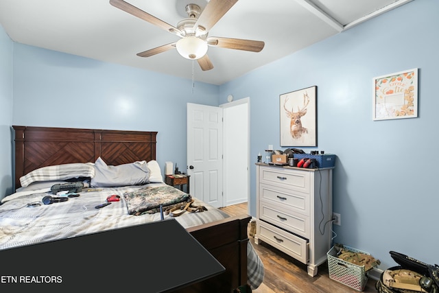 bedroom featuring dark wood-type flooring and ceiling fan