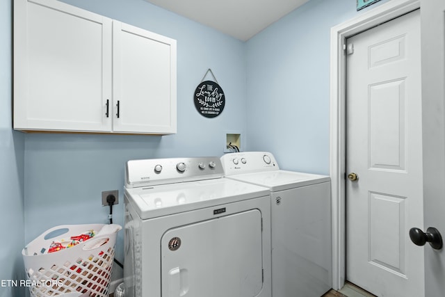 laundry room featuring cabinet space and washer and dryer