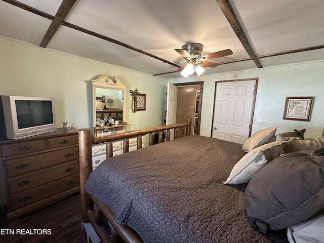 bedroom with beamed ceiling and a ceiling fan