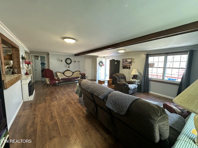 living area featuring dark wood finished floors, beamed ceiling, baseboards, and ornamental molding