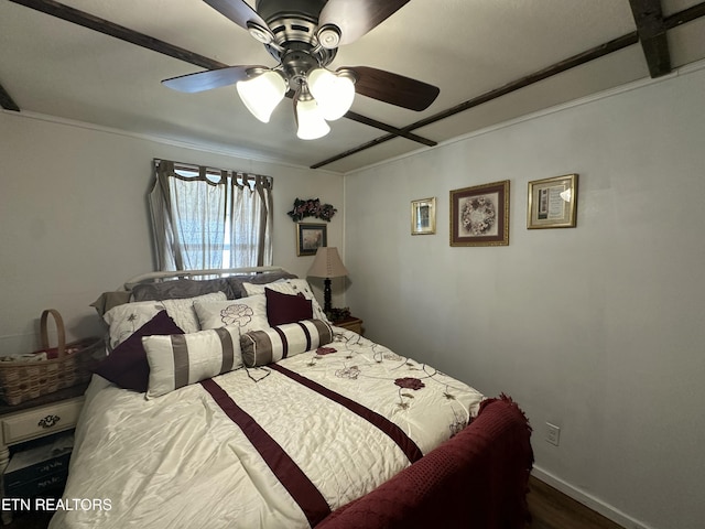 bedroom featuring baseboards and a ceiling fan