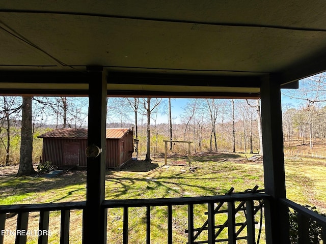 view of yard featuring an outbuilding and a shed