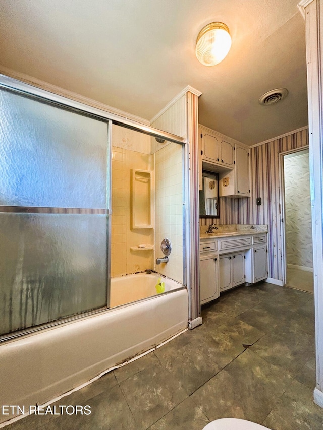 bathroom featuring vanity, visible vents, and enclosed tub / shower combo