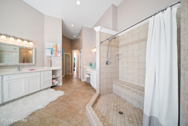 full bath featuring vanity, high vaulted ceiling, recessed lighting, a tile shower, and tile patterned floors