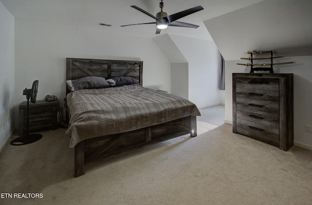 bedroom with visible vents, carpet flooring, lofted ceiling, and ceiling fan