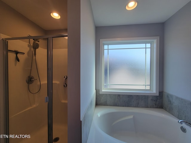 bathroom featuring a garden tub, recessed lighting, and a stall shower