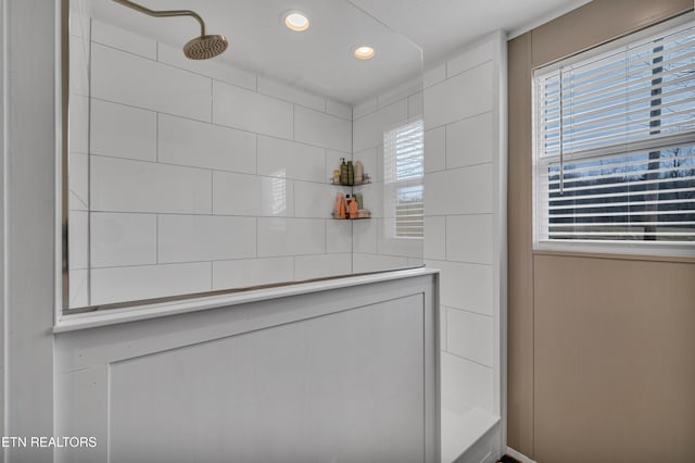 room details with a tile shower and recessed lighting