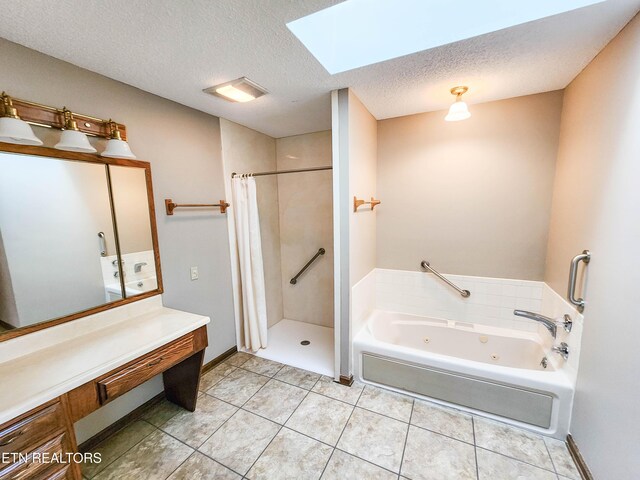 full bathroom featuring a shower stall, a whirlpool tub, a skylight, tile patterned floors, and a textured ceiling