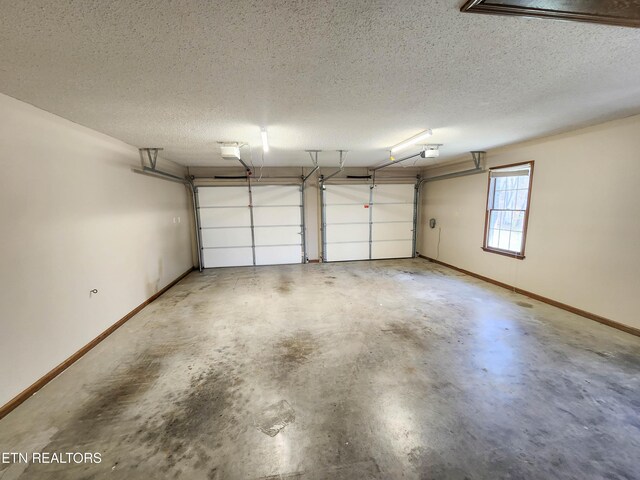 garage featuring baseboards