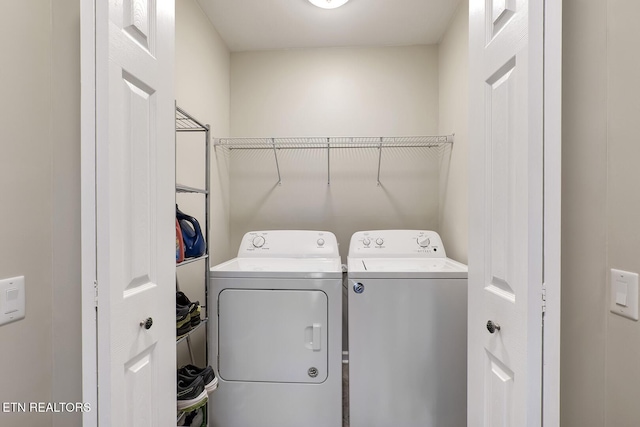 laundry room featuring laundry area and washer and clothes dryer