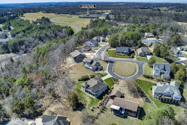 birds eye view of property with a residential view