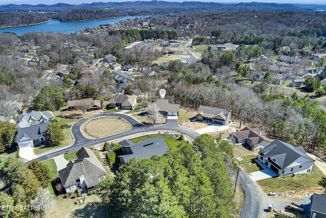 bird's eye view with a forest view, a residential view, and a water view