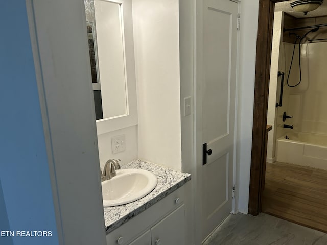 full bathroom featuring vanity and bathing tub / shower combination