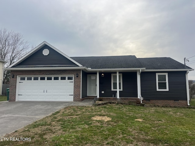 single story home with a porch, an attached garage, concrete driveway, a front lawn, and crawl space