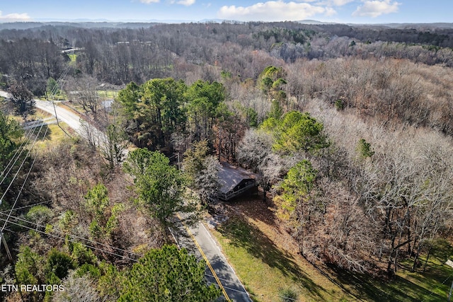 aerial view featuring a view of trees