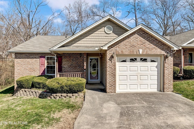 single story home featuring driveway, a porch, an attached garage, a front yard, and brick siding