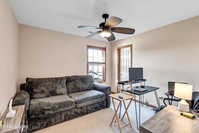 living area with carpet flooring, a ceiling fan, and visible vents