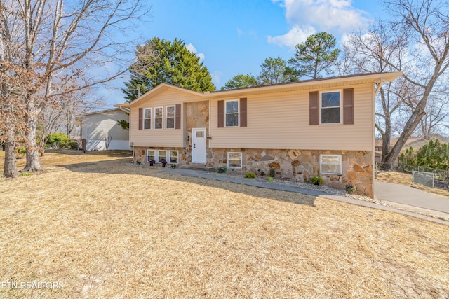 raised ranch with a front lawn