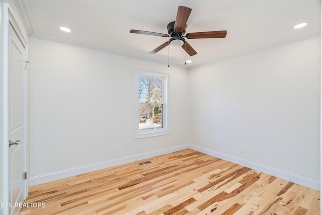 empty room with crown molding, ceiling fan, baseboards, recessed lighting, and wood finished floors