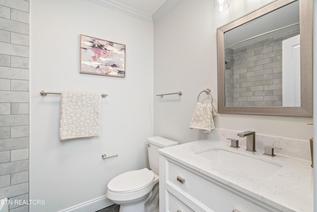 bathroom featuring vanity, toilet, crown molding, and walk in shower