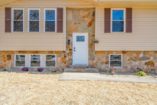 entrance to property with stone siding