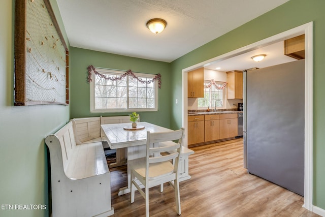 dining area featuring light wood-type flooring