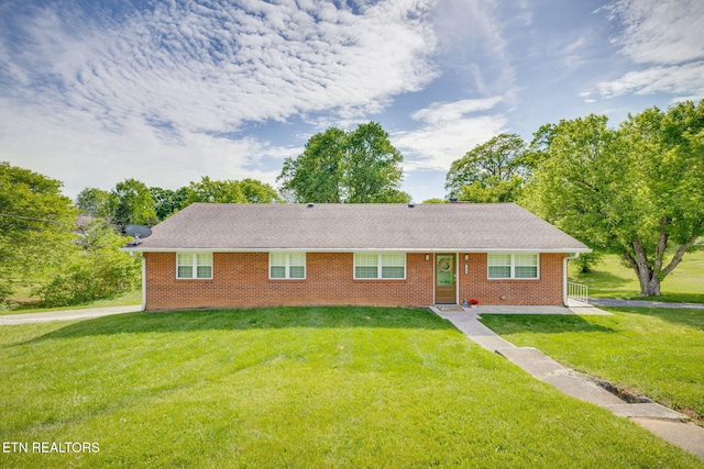 single story home featuring a shingled roof, brick siding, and a front yard
