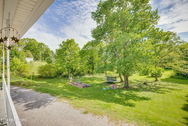 view of home's community featuring a lawn