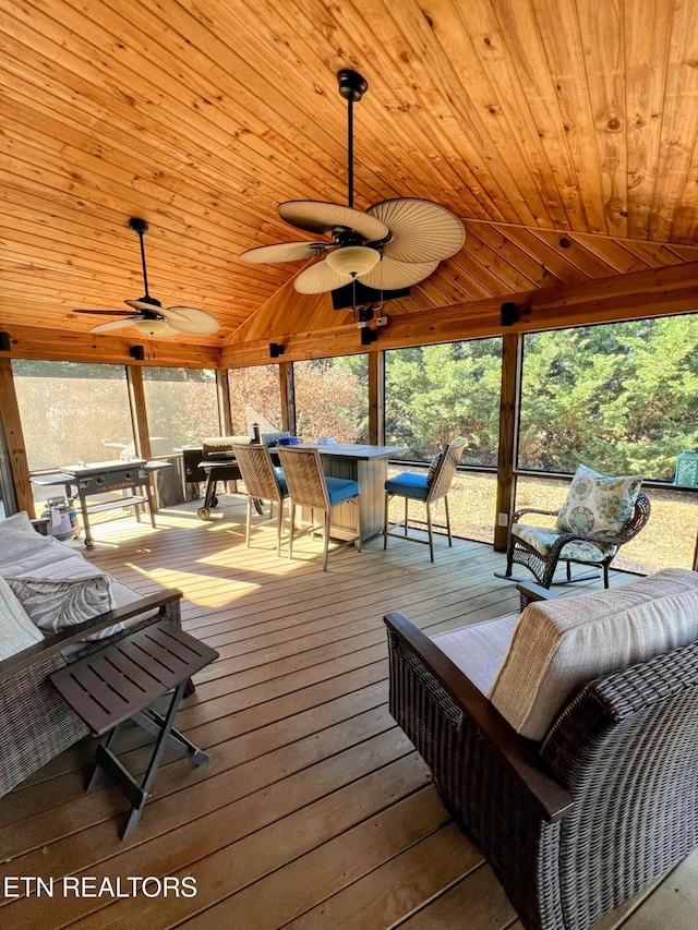 deck featuring outdoor dry bar and a ceiling fan