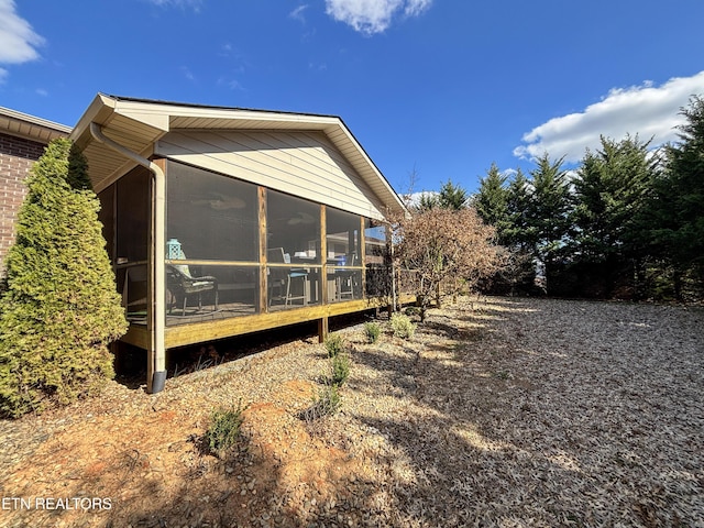 view of home's exterior featuring a sunroom