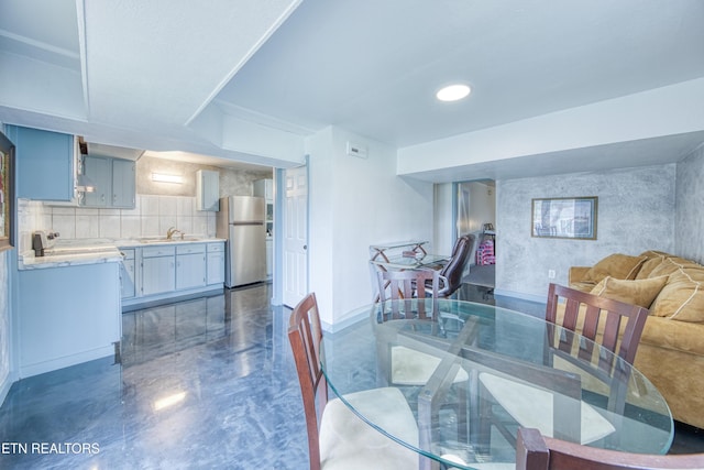 dining space with baseboards