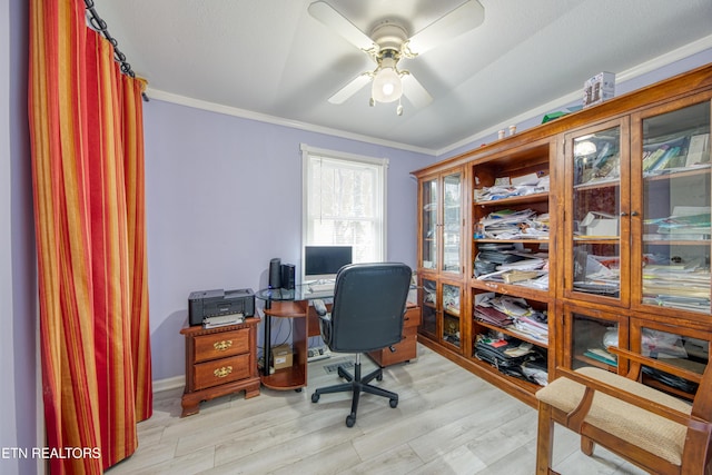 office space featuring crown molding, light wood-style flooring, and ceiling fan