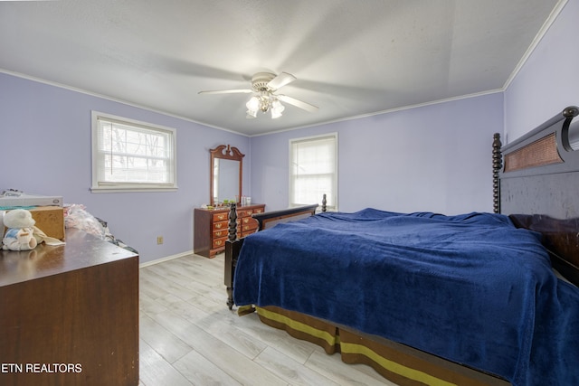 bedroom with multiple windows, light wood-type flooring, baseboards, and ornamental molding