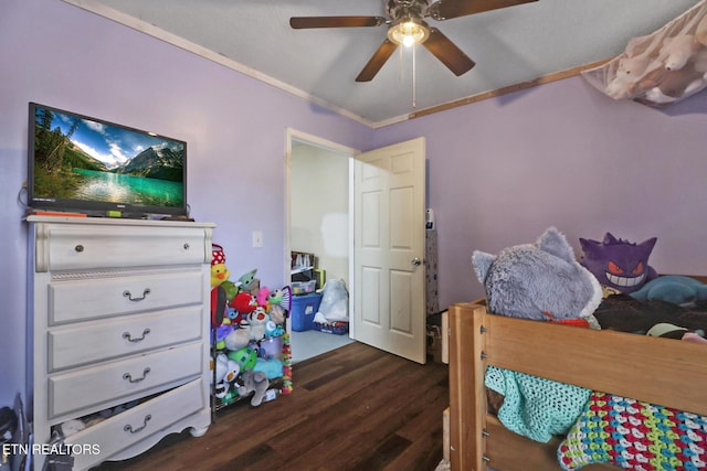 bedroom featuring crown molding, ceiling fan, and dark wood-style flooring